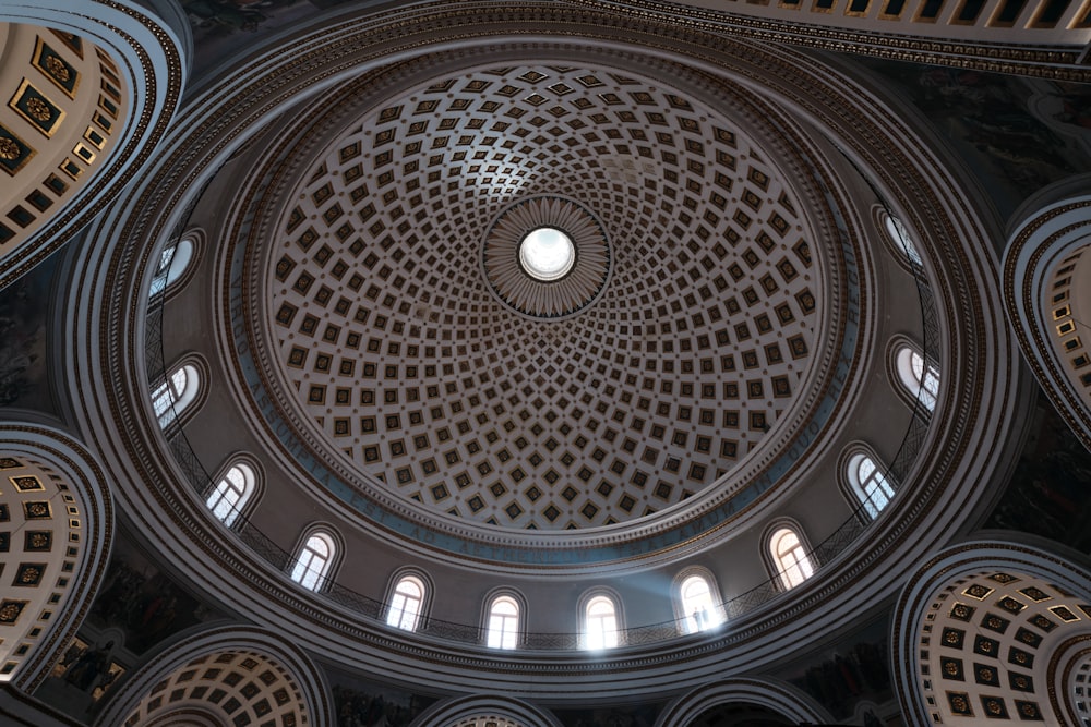 the ceiling of a building with many windows