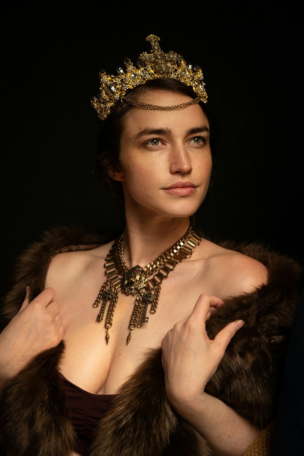 a woman wearing a tiara and a fur coat