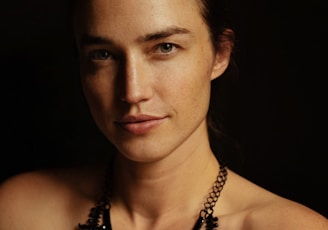 a woman with a necklace on her neck