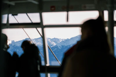 Tourists enjoying a scenic mountain view from a comfortable cab.