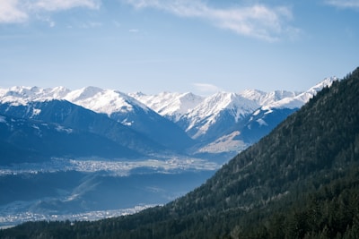 Snow-capped mountains in the Principado de Asturias with lush green valleys below.