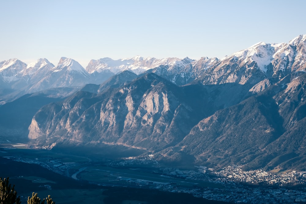 a view of a mountain range with a city below