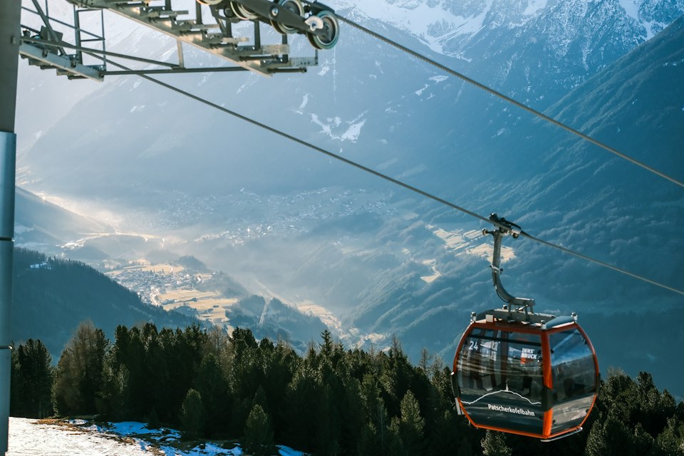 Cable car ascending the Nordkette above Innsbruck at sunset