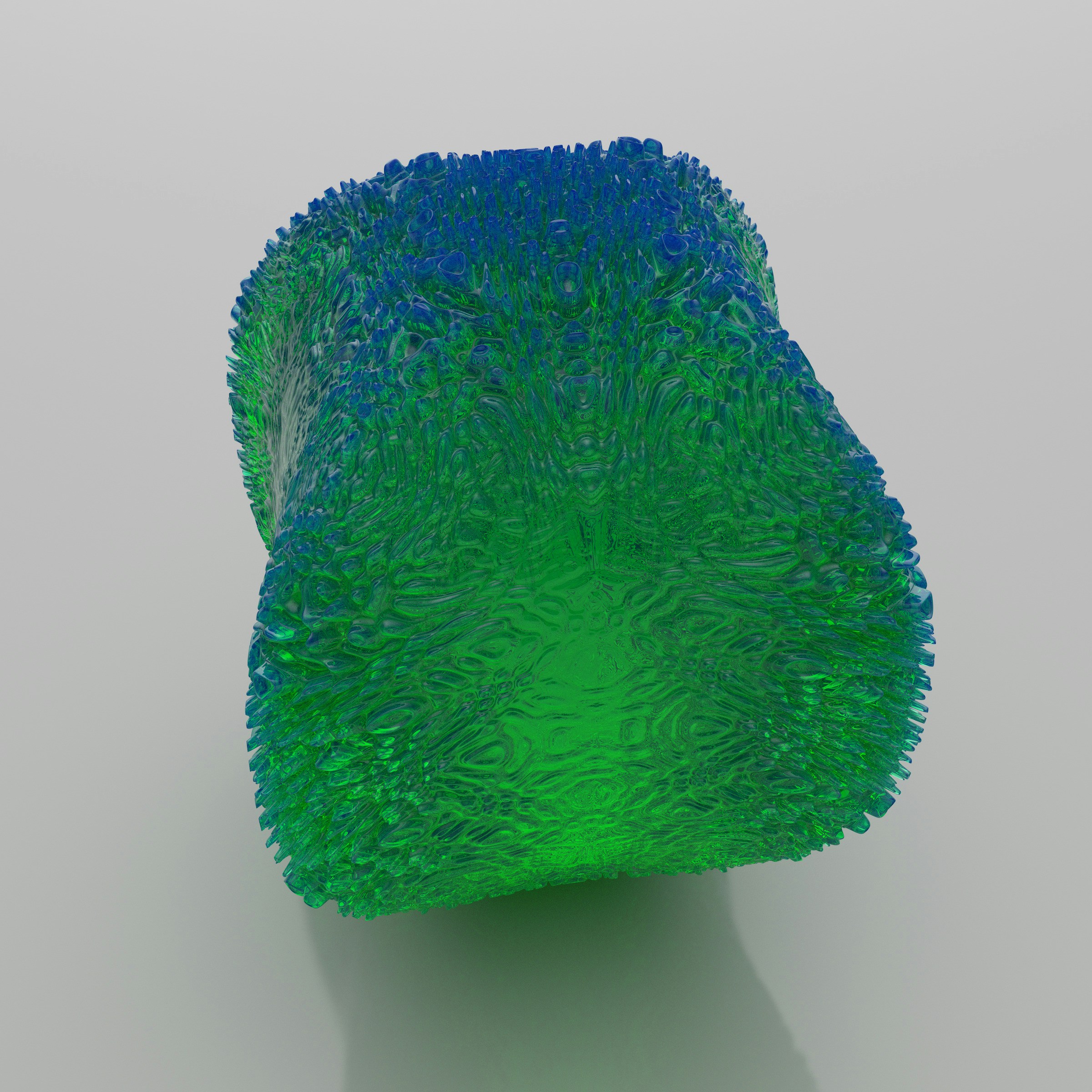 a blue and green vase sitting on top of a table