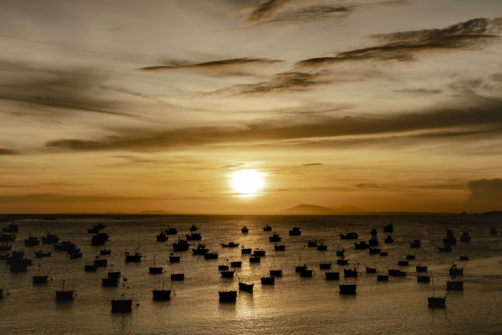 a group of boats floating on top of a body of water