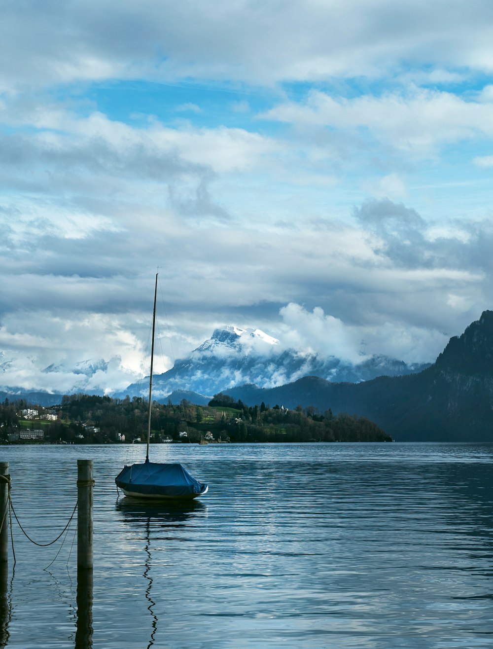 a small boat floating on top of a body of water