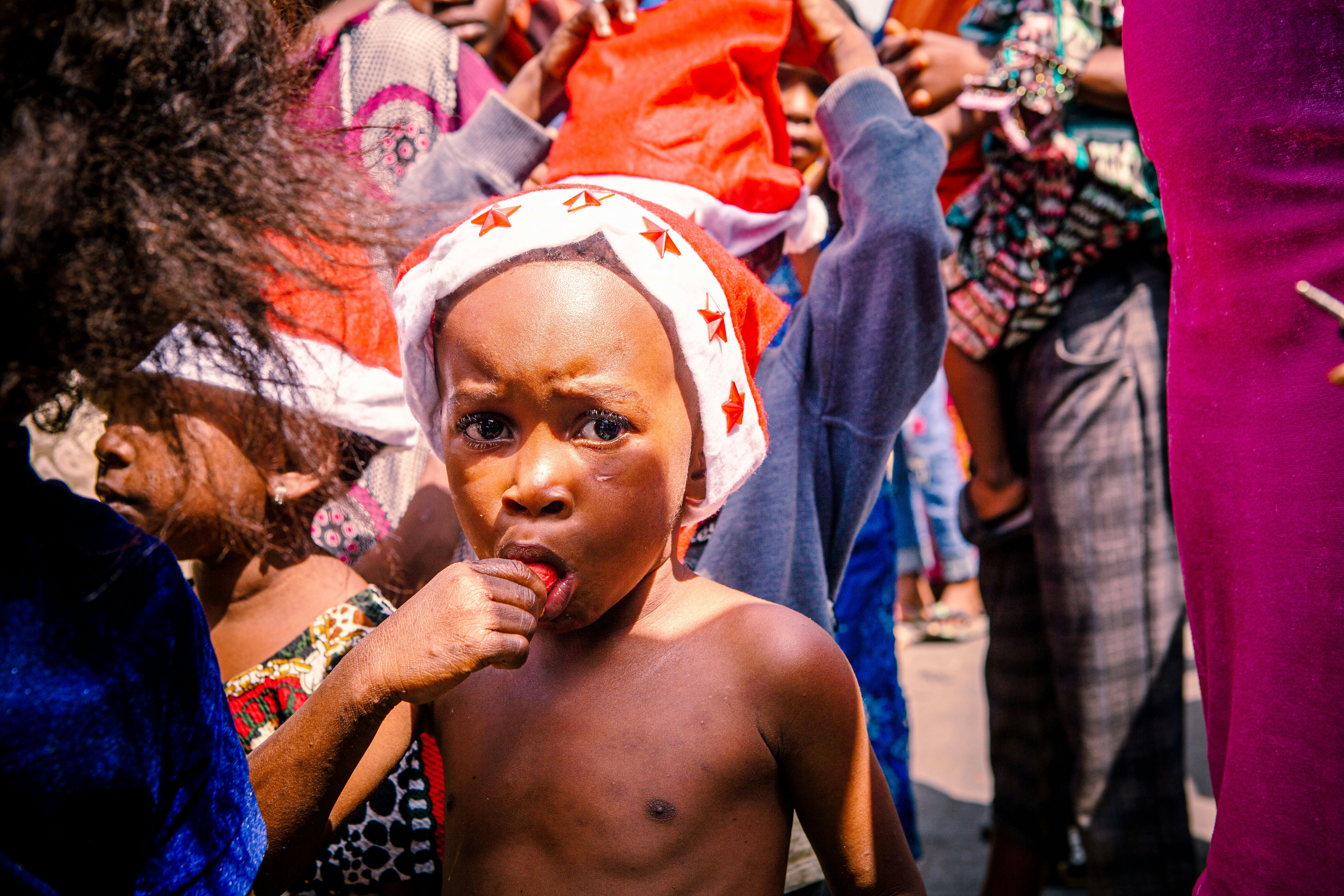 a small child with a towel on his head