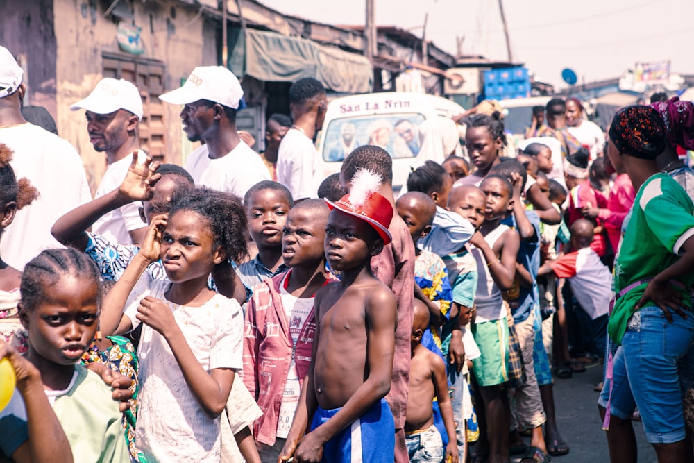 a group of young children standing next to each other