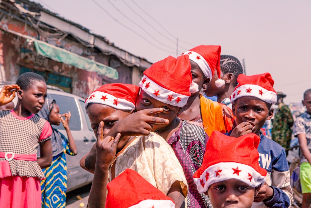 a group of people wearing red and white hats