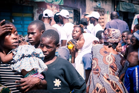 a group of people standing around each other