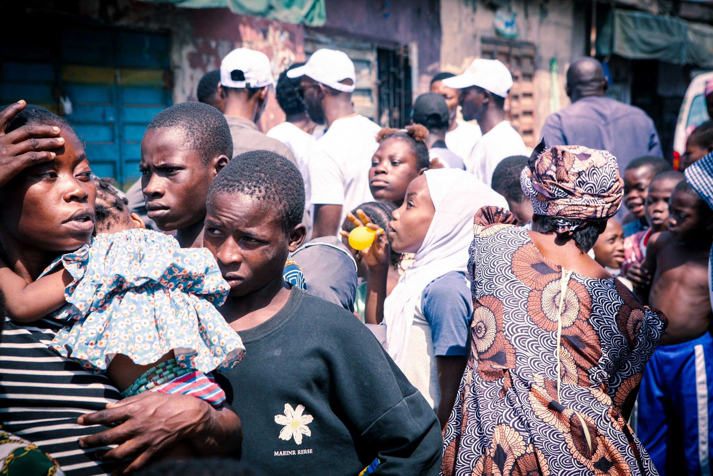 queue of people waiting outdoors nigeria