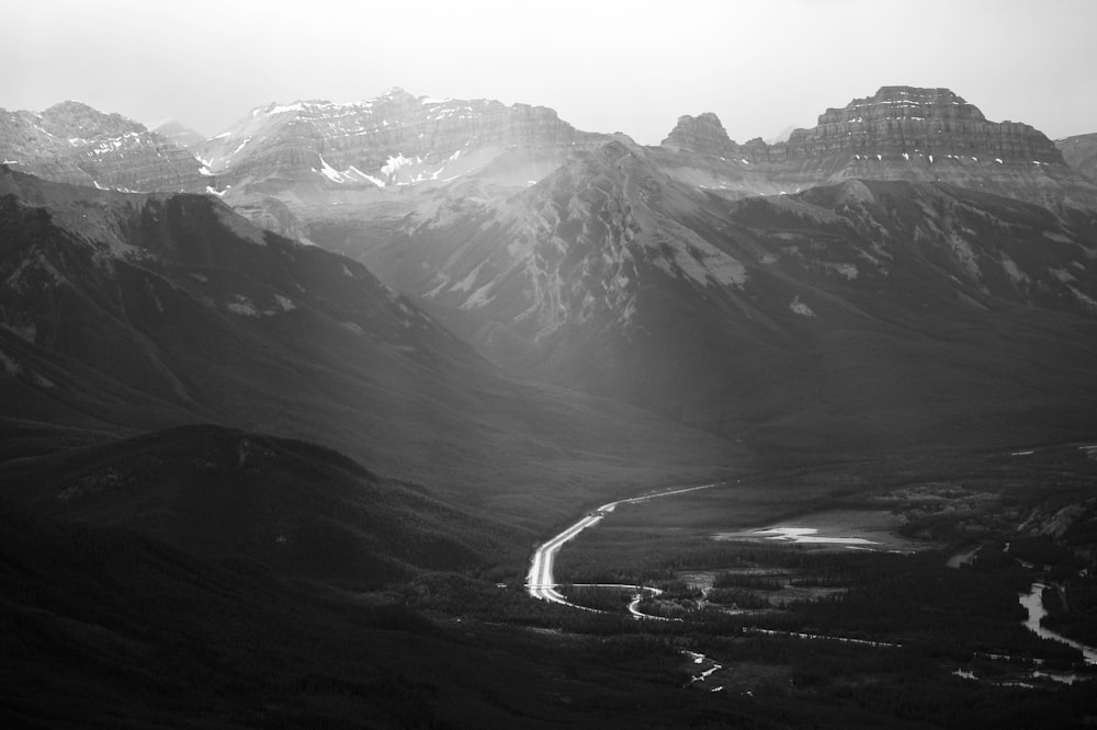 a black and white photo of a mountain range