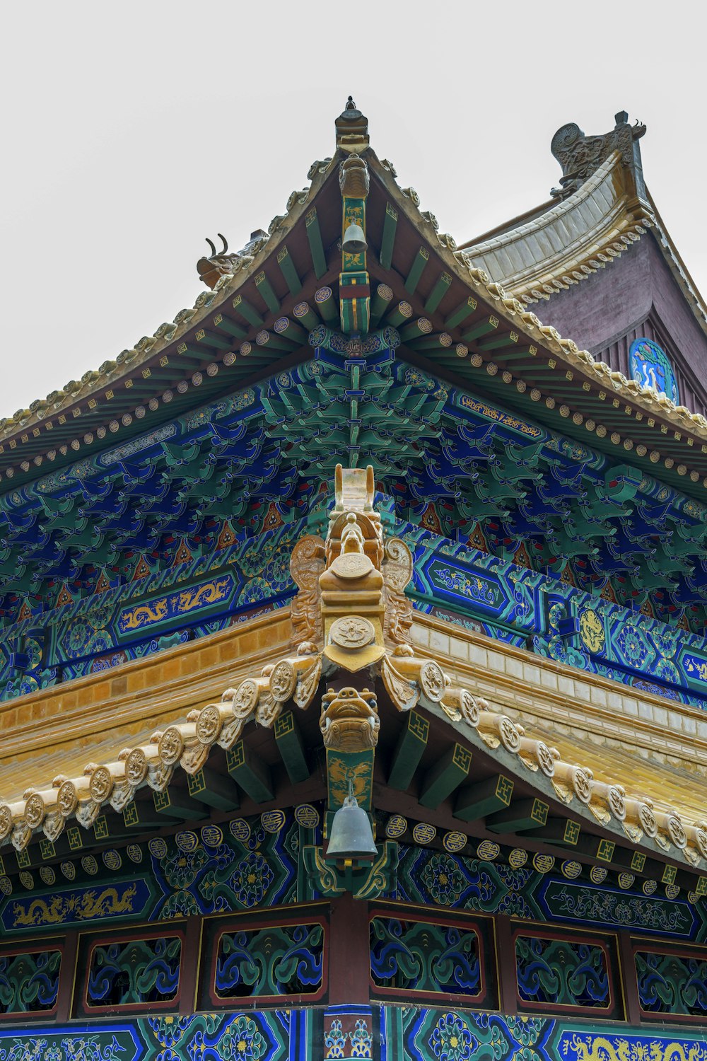 a colorful building with a bell on top of it
