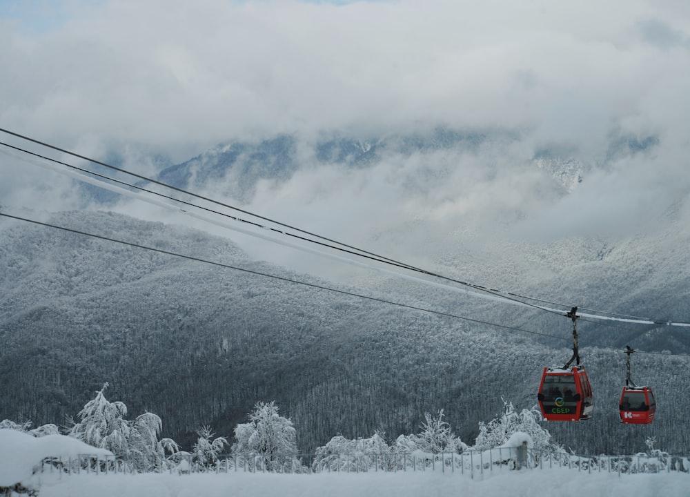 a ski lift going up a snowy mountain