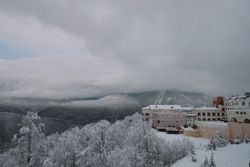 a view of a snowy mountain with a building in the foreground