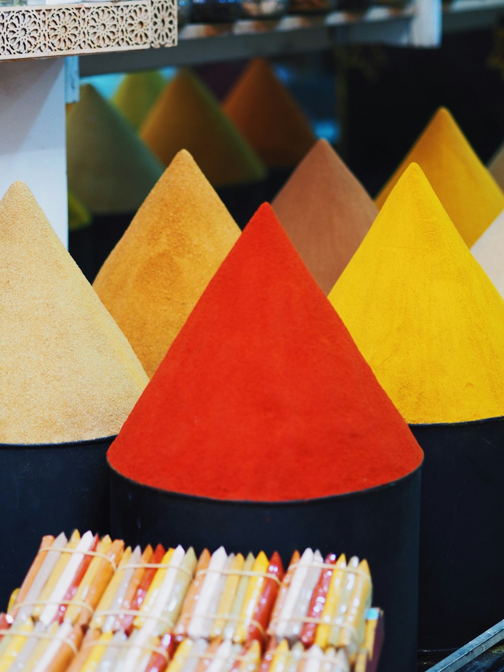 a bunch of different colored cones in a store