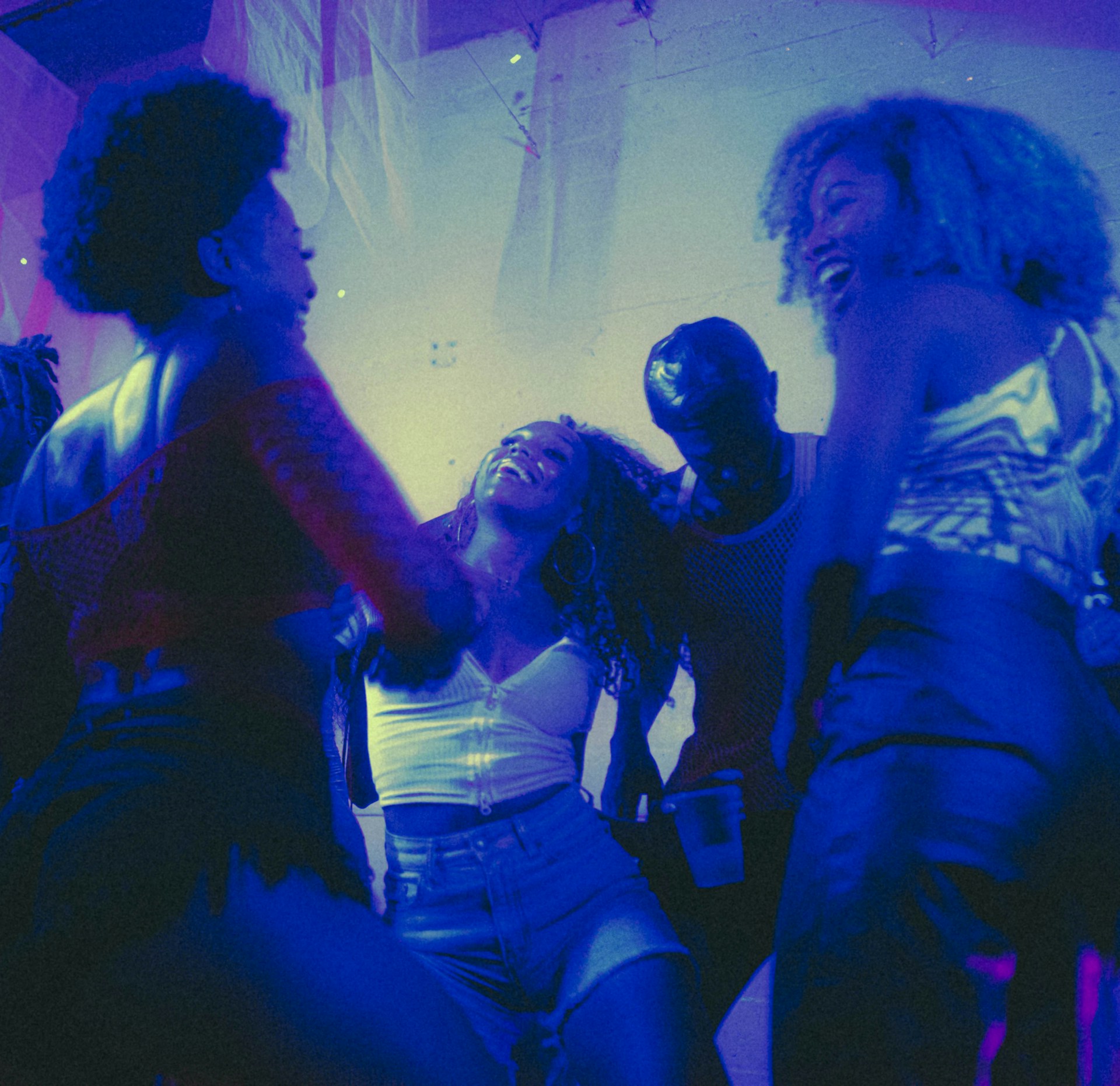 a group of people dancing in a room