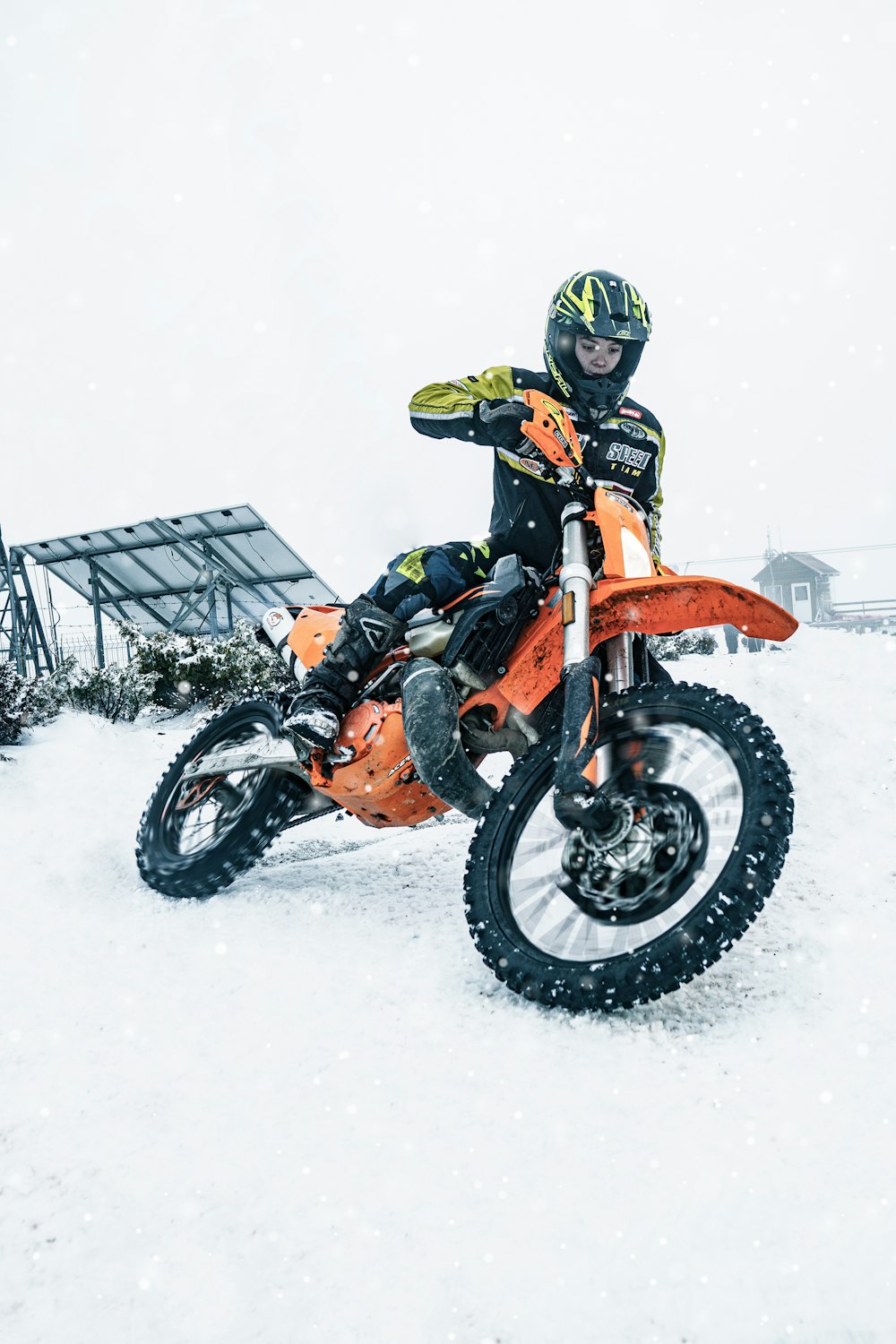 a person on a dirt bike in the snow