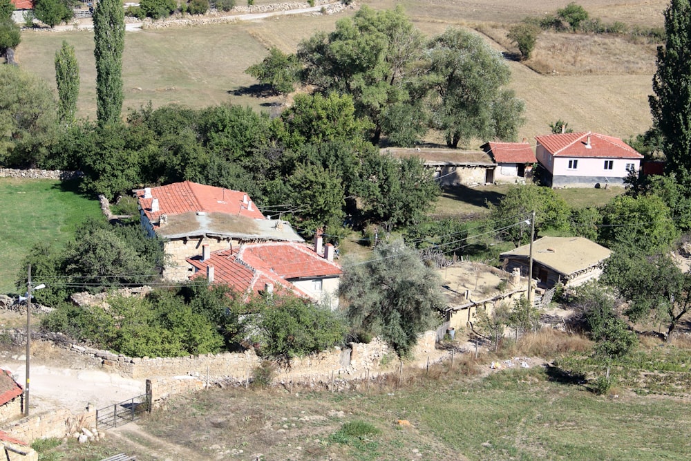 an aerial view of a house surrounded by trees