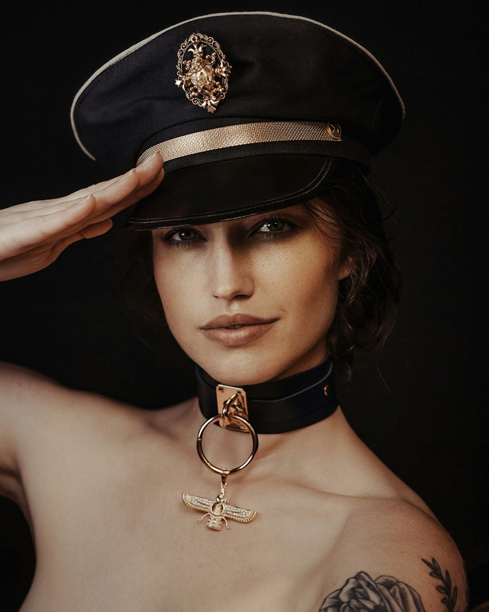 a woman wearing a hat and a choker