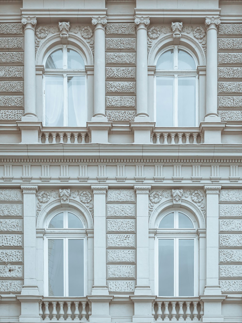 a tall building with many windows and a clock