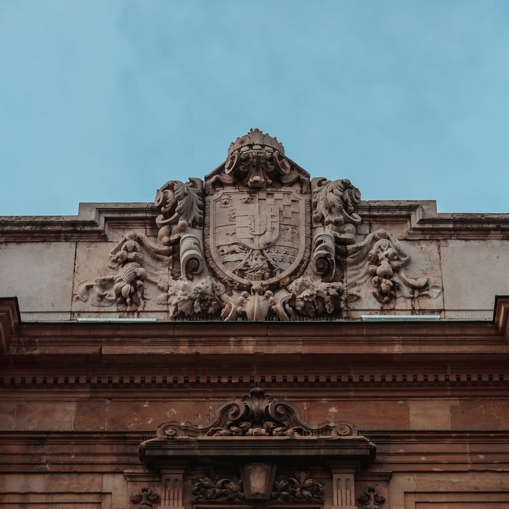 a building with a coat of arms on the front of it