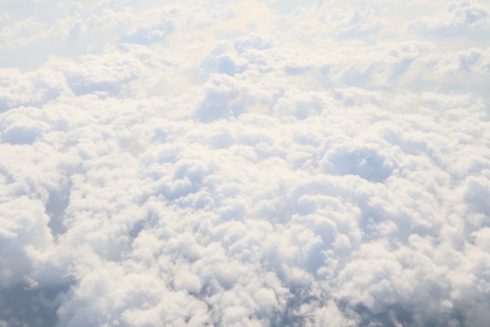 a view of the clouds from an airplane window