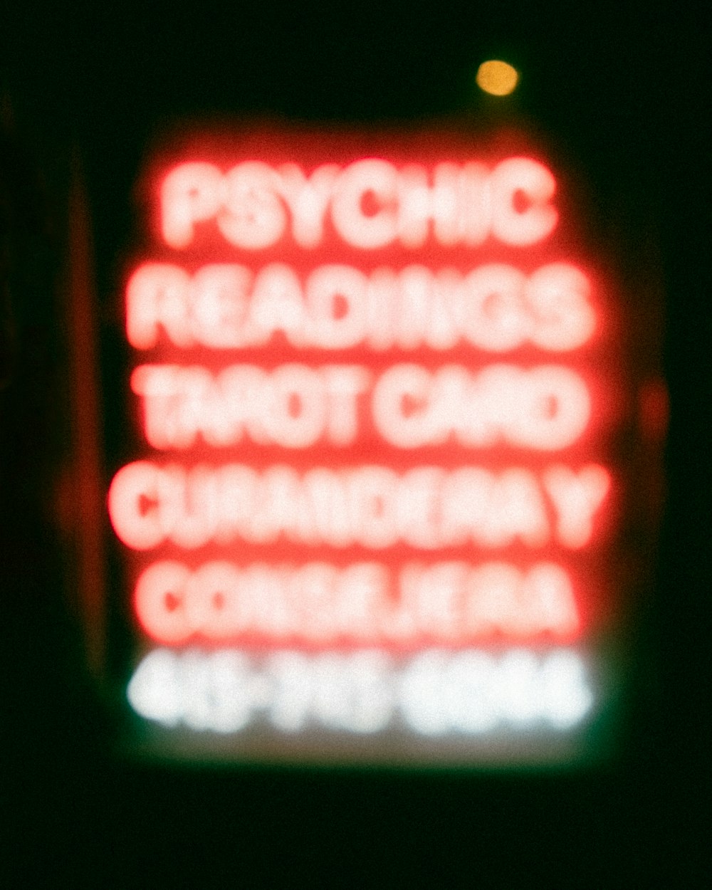a red sign that says psychic readings and not card reader