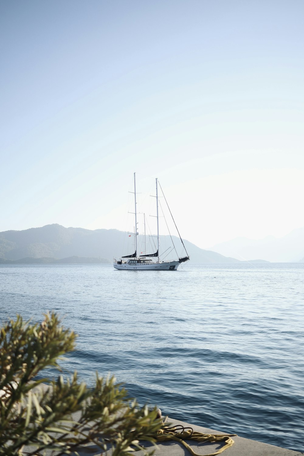 a sailboat floating on top of a large body of water