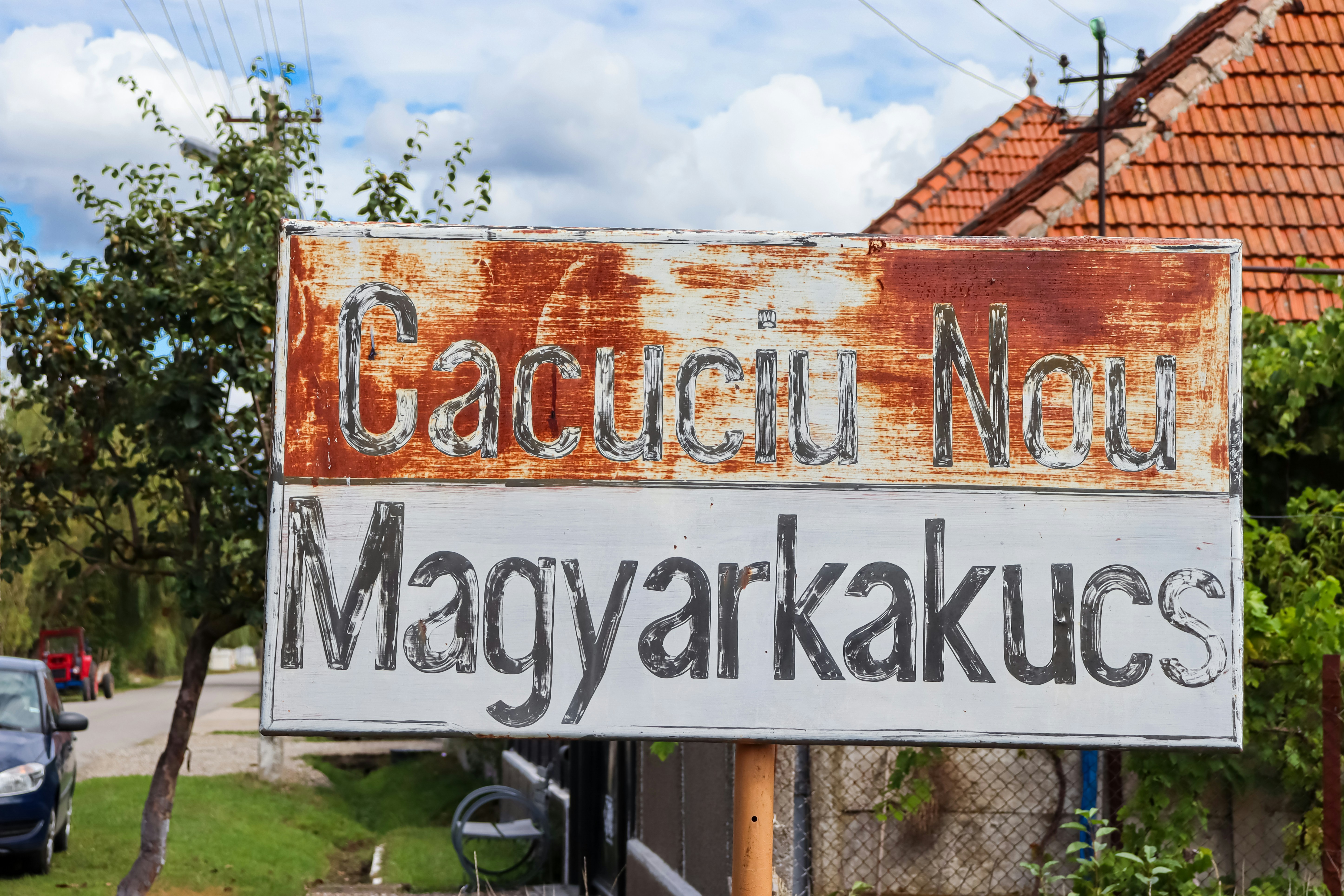 a sign that is on the side of a road