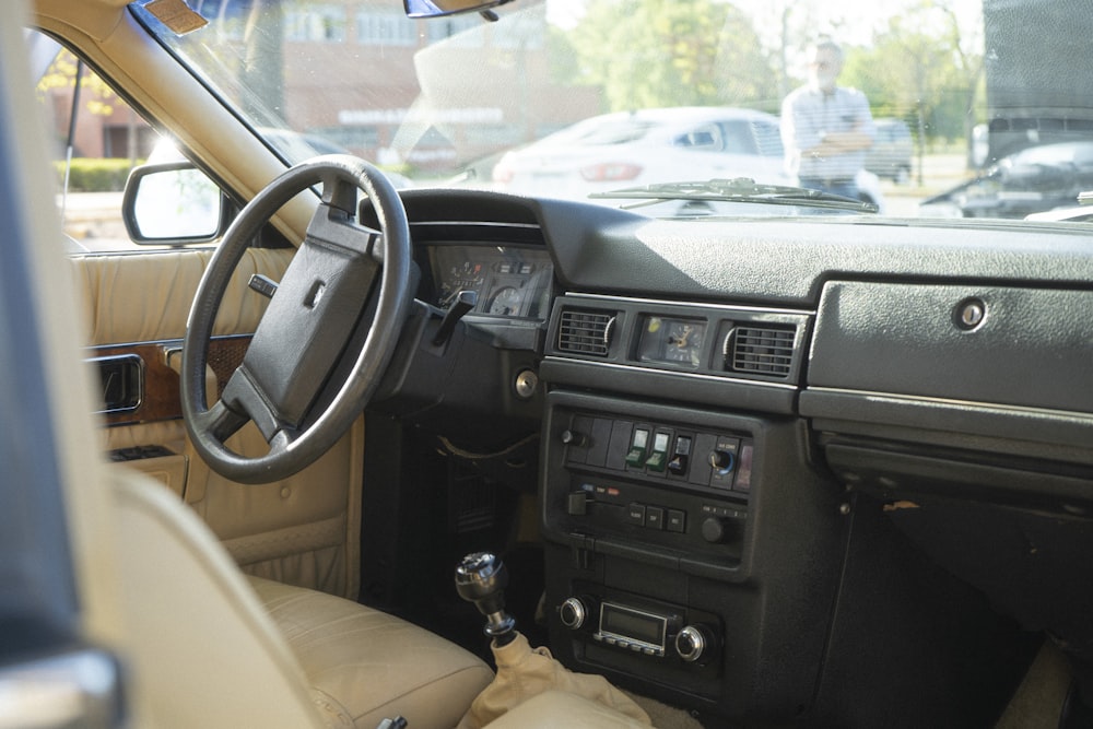 the interior of a car with a dash board and steering wheel