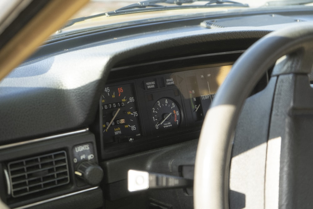 the dashboard of a car with a dash light on