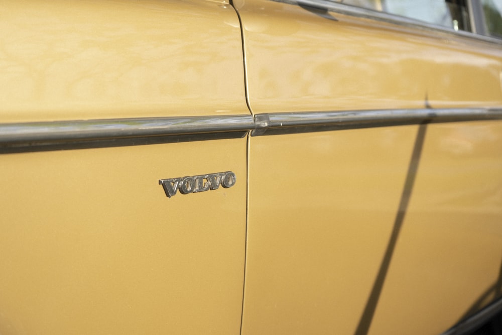 a close up of the front of a yellow car