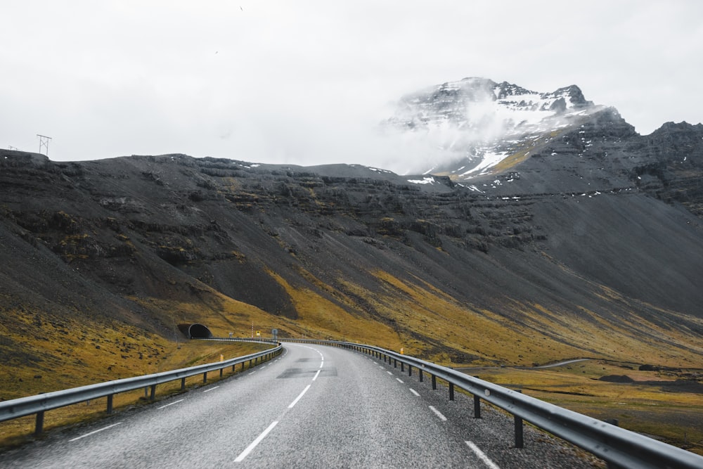 a road with a mountain in the background