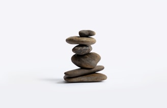 Stack of rocks sitting on top of each other perfectly balanced.