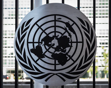 Icon of a globe with a respectful hand supporting it, symbolizing international repatriation.