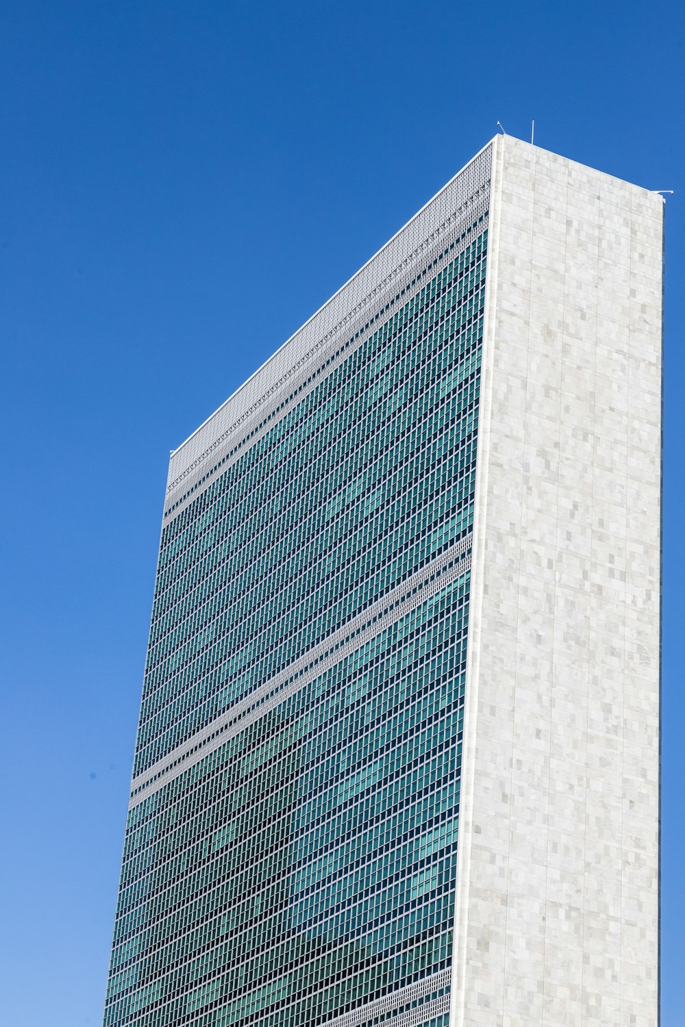 a very tall building with a clock on it's side