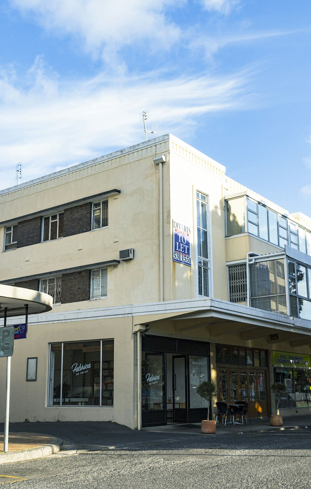 a white building with a blue sky in the background