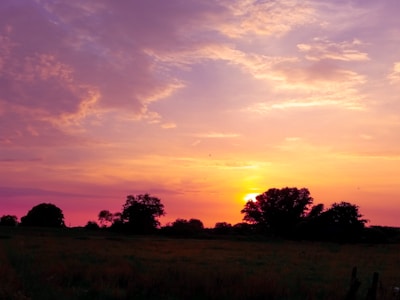 A tranquil sunset over a rural landscape.