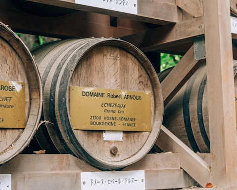 A selection of various second-hand wine barrels displayed in a rustic setting.