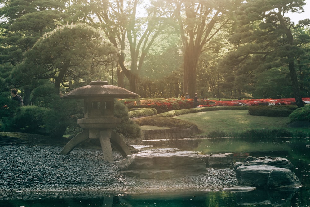 a japanese garden with a pond and a pagoda