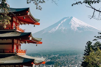 a view of a mountain with pagodas in front of it