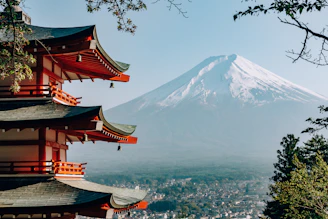 a view of a mountain with pagodas in front of it