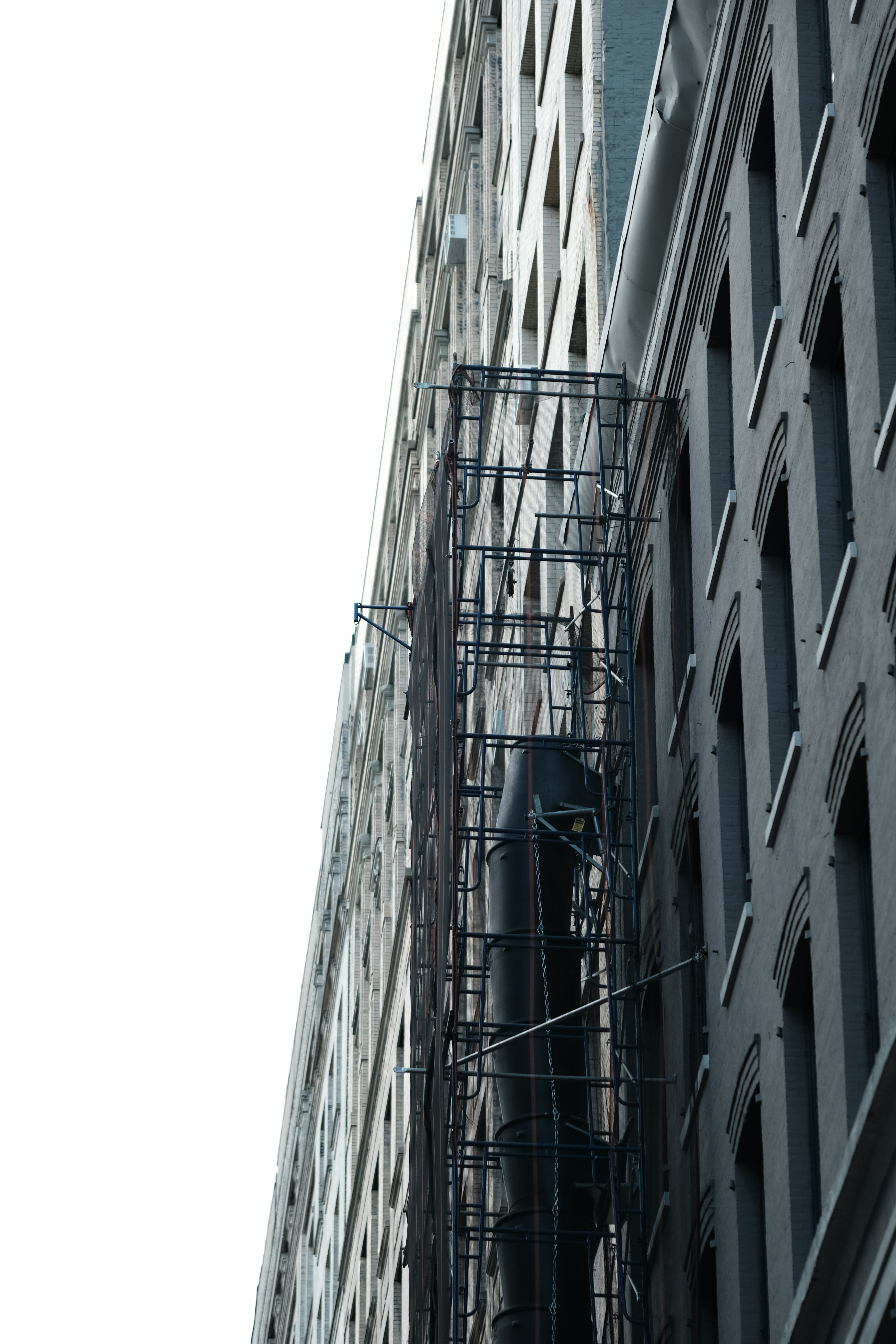 a tall building with scaffolding on the side of it