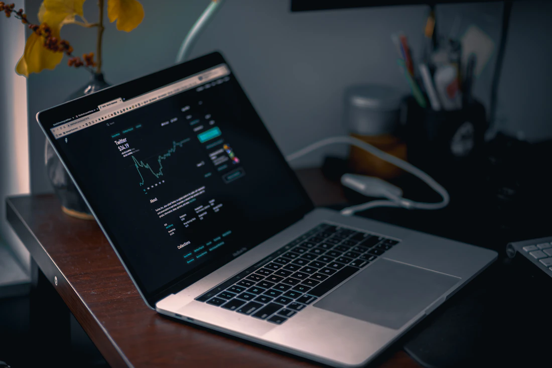 Laptop displaying a financial market chart