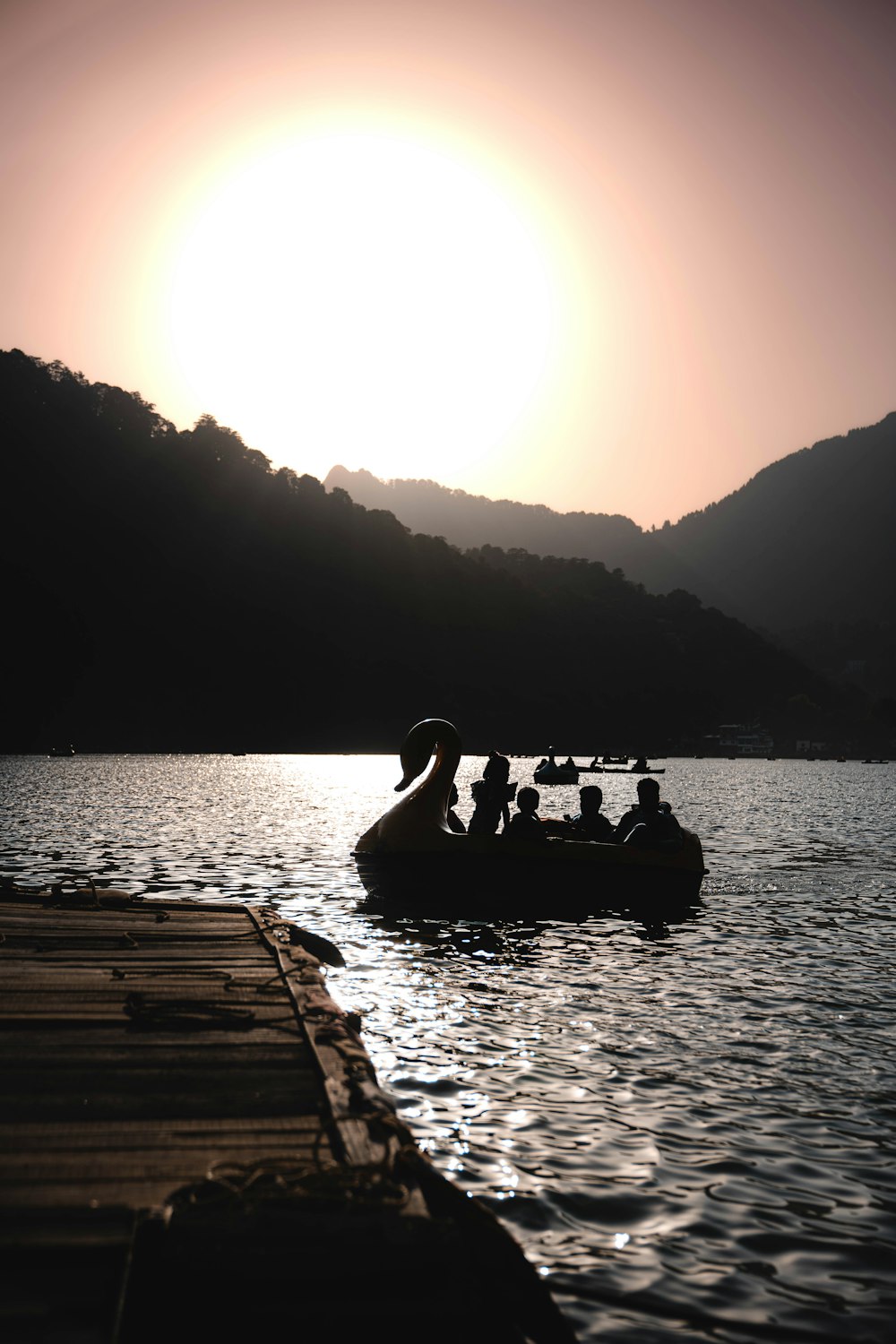 a group of people riding on the back of a boat