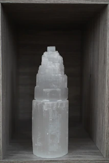 Elegant selenite towers glowing softly against a dark background.