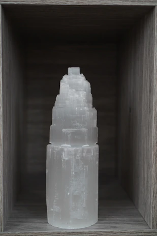 Elegant selenite towers glowing softly against a dark background.