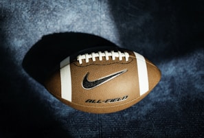 a close up of a football on a blue background