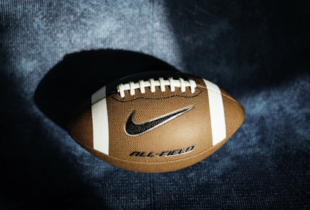 a close up of a football on a blue background